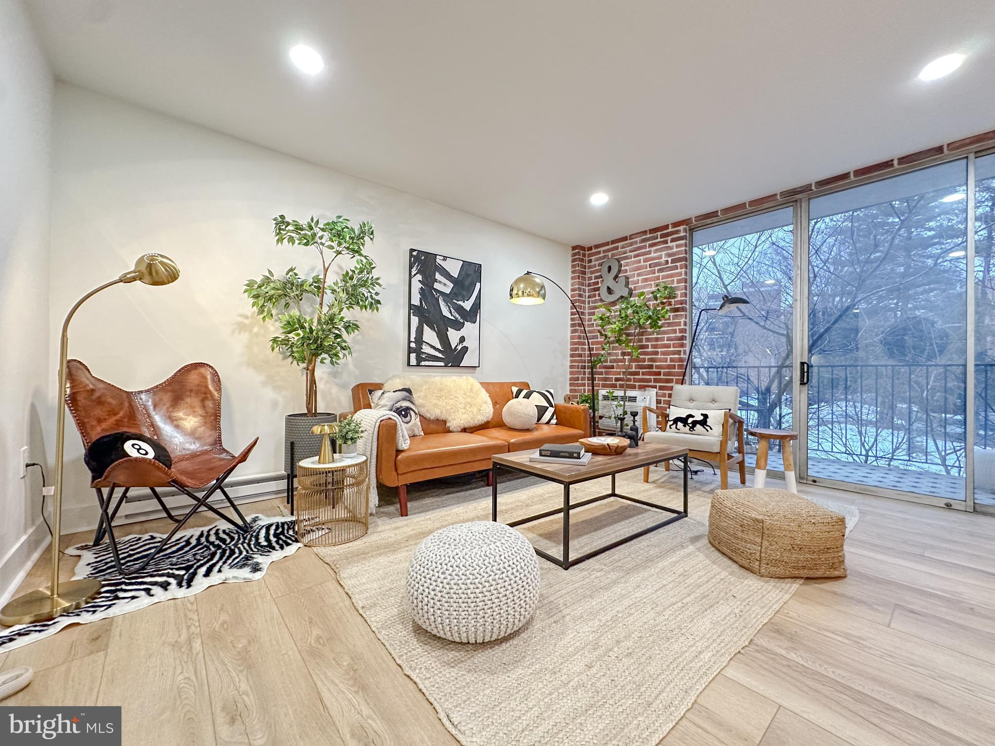 3245 Rio Drive, Unit 206 Falls Church, VA 22041 - Photo 7 of 36 a living room with furniture and a large window