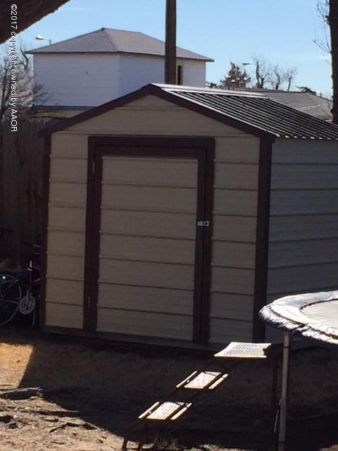 4317 South Travis Street Amarillo, TX 79110 - Photo 20 of 20 a backyard of a house with table and chairs