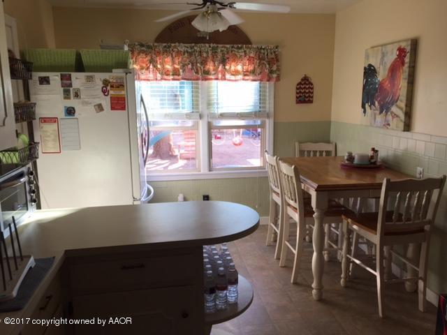 4317 South Travis Street Amarillo, TX 79110 - Photo 5 of 20 a view of a dining room with furniture and chandelier