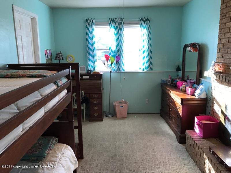 4317 South Travis Street Amarillo, TX 79110 - Photo 8 of 20 a room with storage and utility