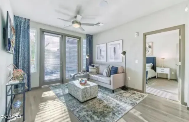 a living room with furniture and a large window