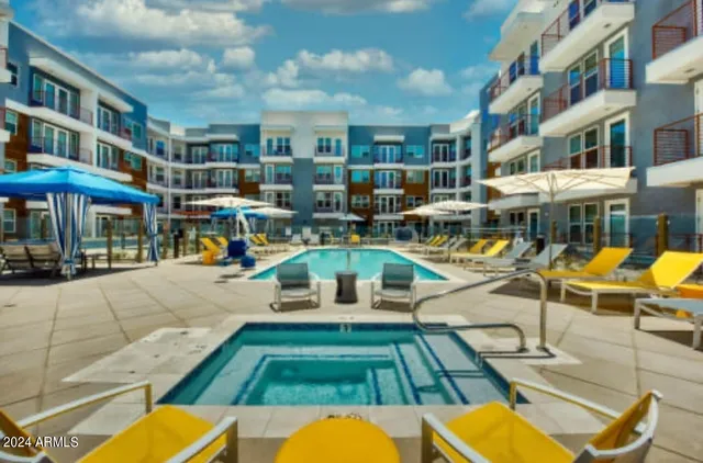 a view of a swimming pool with a lounge chairs
