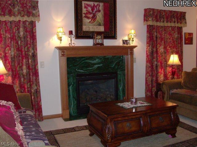 7036 Sweetwater Road Northeast Canton, OH 44721 - Photo 3 of 14 The main living space is complimented with a lovely custom fireplace focal point that encourages the family to gather round.