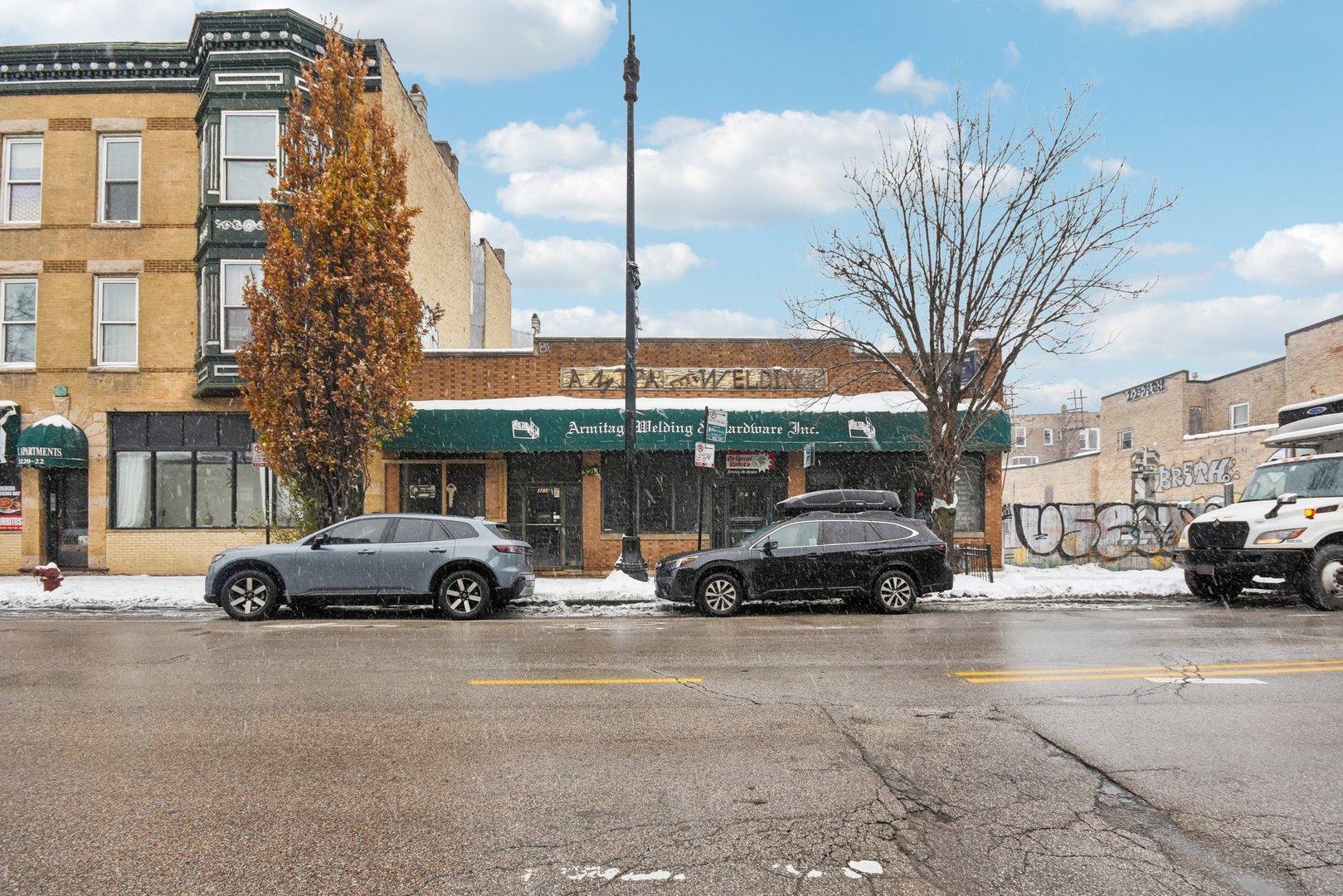 3212 West Armitage Avenue Chicago, IL 60647 - Photo 1 of 9 a car parked in front of a building