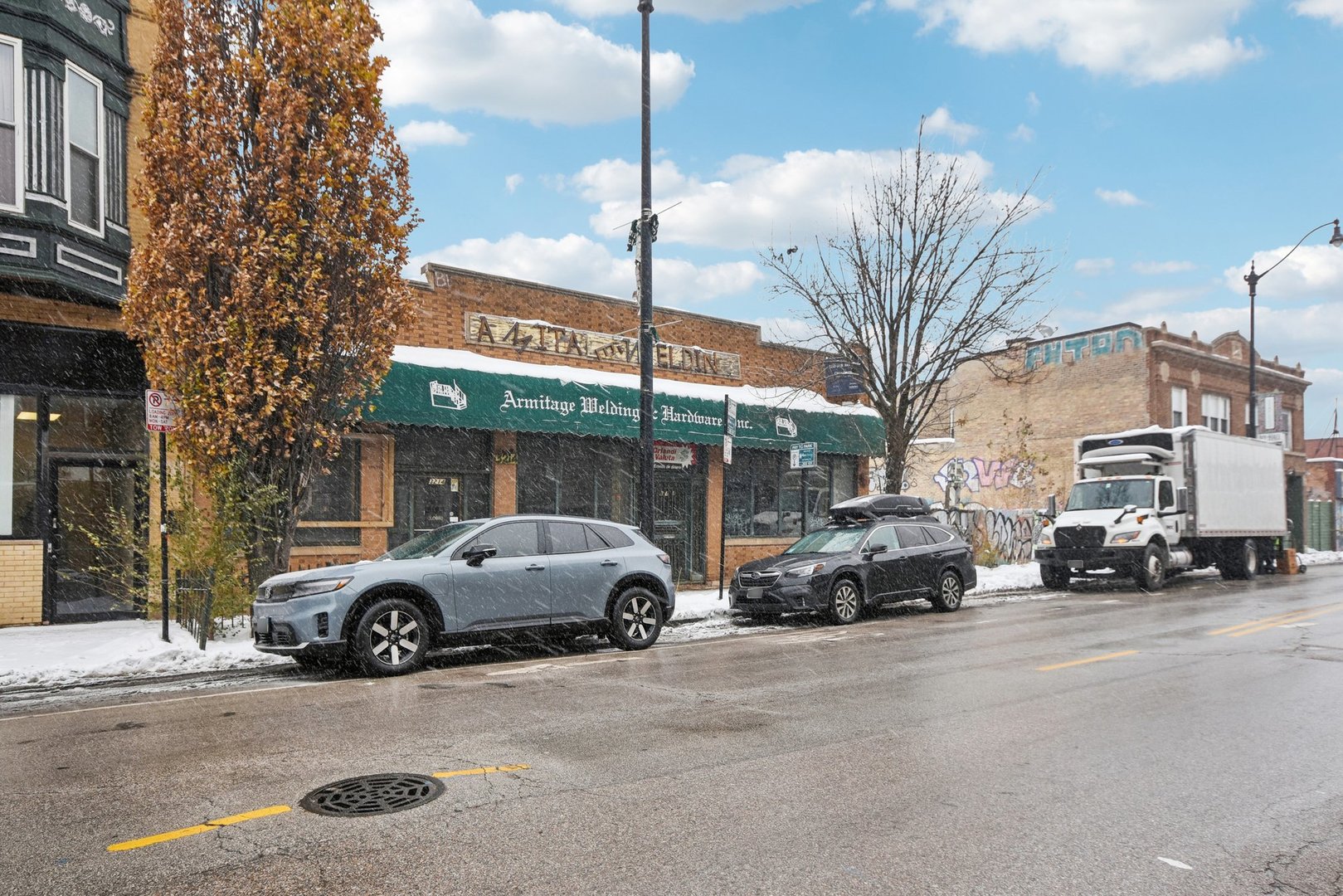 3212 West Armitage Avenue Chicago, IL 60647 - Photo 2 of 9 a view of a cars parked in front of a building