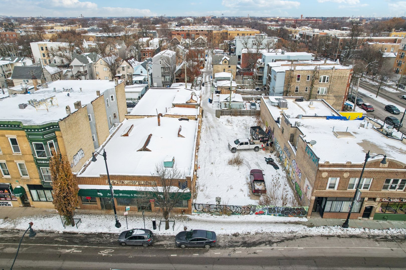 3212 West Armitage Avenue Chicago, IL 60647 - Photo 6 of 9 an aerial view of residential houses with outdoor space