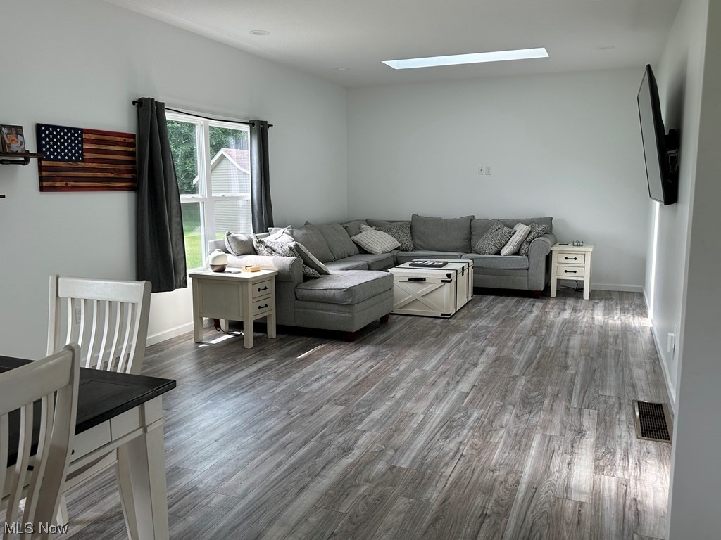 441 Rabbit Run Lane Wellington, OH 44090 - Photo 14 of 35 View of light laminate floored living room