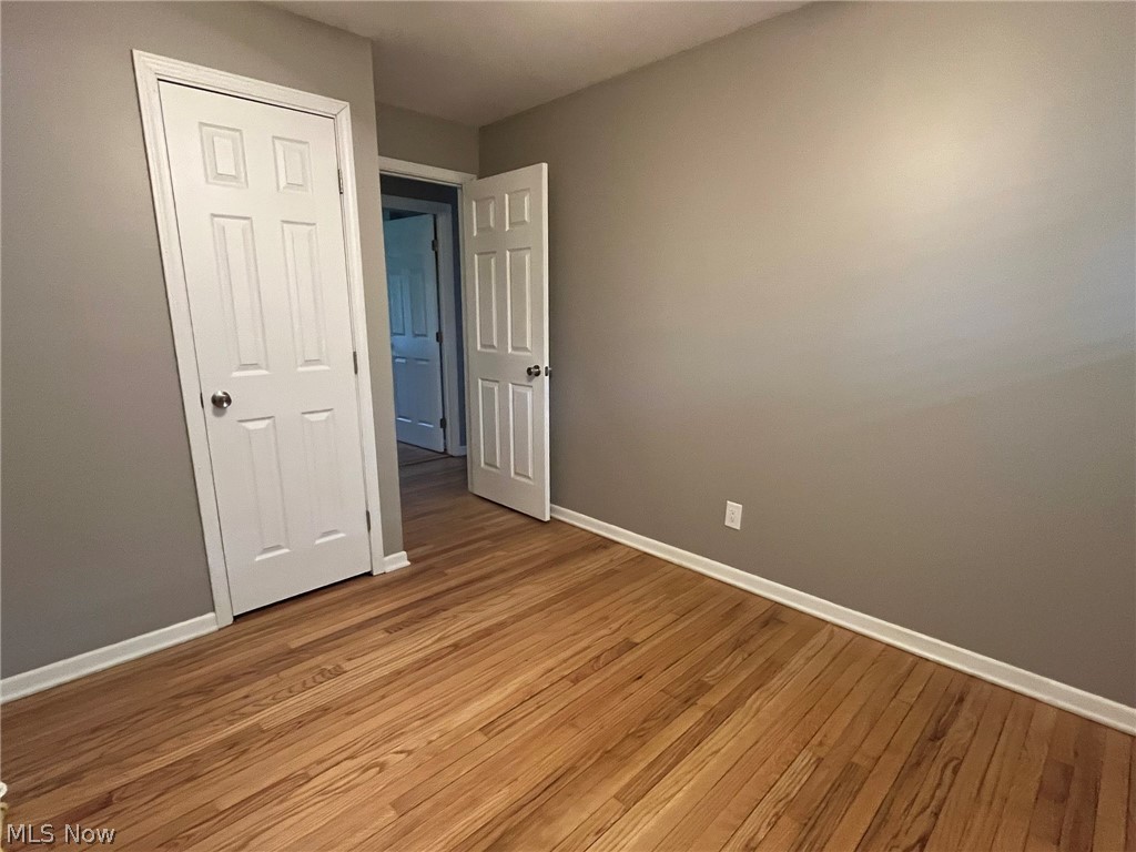 1166 Hampton Road Kent, OH 44240 - Photo 13 of 26 2nd bedroom featuring hardwood floors. New painted 6 panel doors throughout