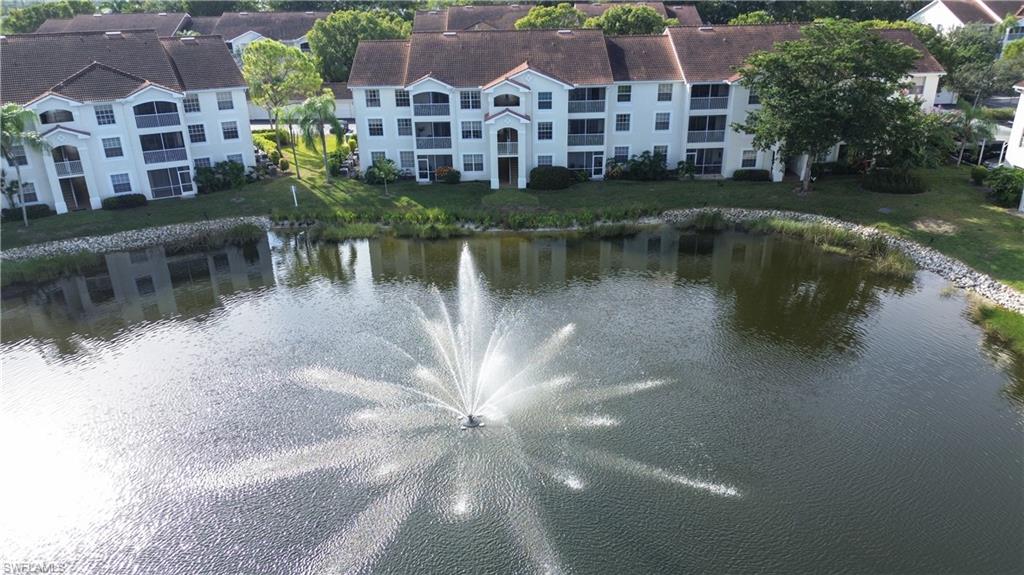 a aerial view of a house with a lake view