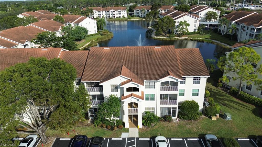 4650 St Croix Lane, Unit 731 Naples, FL 34109 - Photo 20 of 29 an aerial view of a house with yard swimming pool and outdoor seating