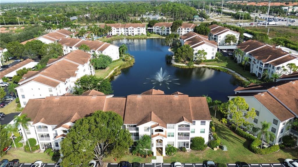 4650 St Croix Lane, Unit 731 Naples, FL 34109 - Photo 21 of 29 an aerial view of residential houses with outdoor space