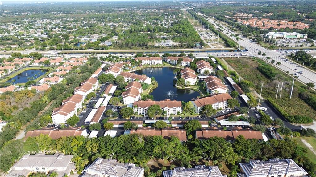 4650 St Croix Lane, Unit 731 Naples, FL 34109 - Photo 22 of 29 an aerial view of residential houses with outdoor space