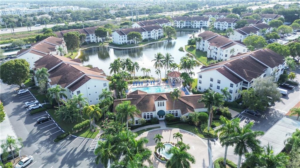 4650 St Croix Lane, Unit 731 Naples, FL 34109 - Photo 27 of 29 an aerial view of residential houses with outdoor space and lake view