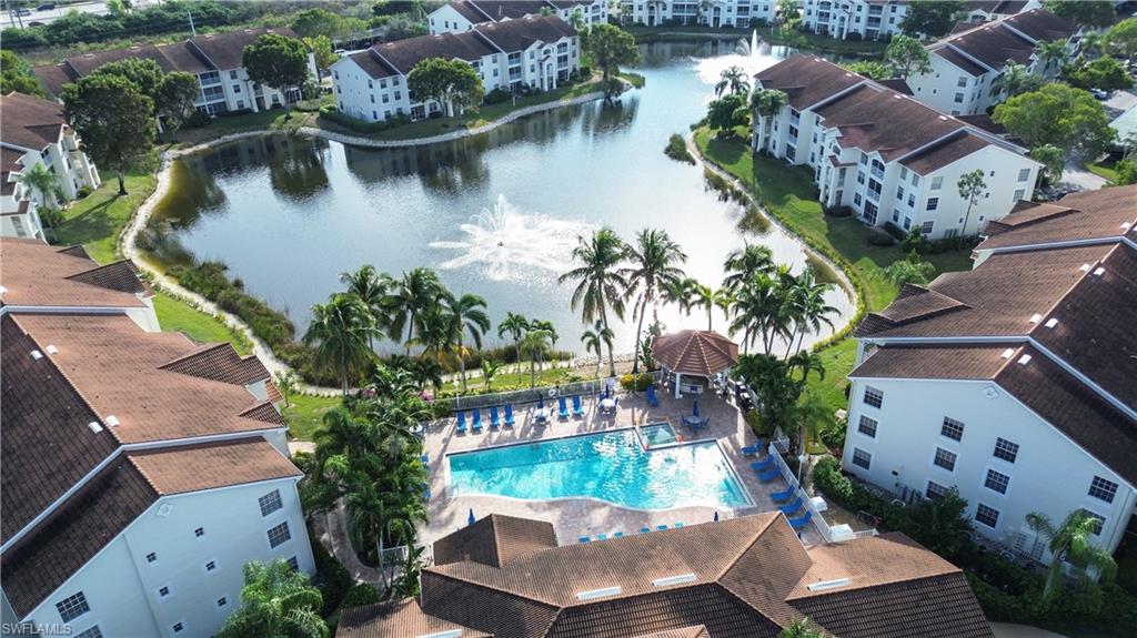 4650 St Croix Lane, Unit 731 Naples, FL 34109 - Photo 28 of 29 an aerial view of house with yard swimming pool and outdoor seating