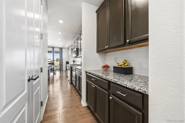 a view of a dining room with furniture and wooden floor
