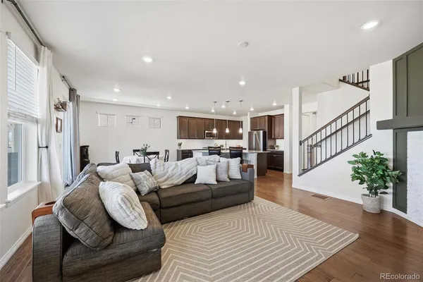 a spacious bedroom with a bed and a couch