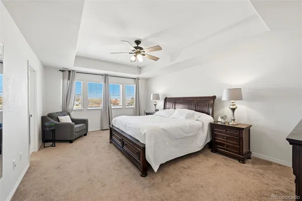 a bedroom with bed and a window