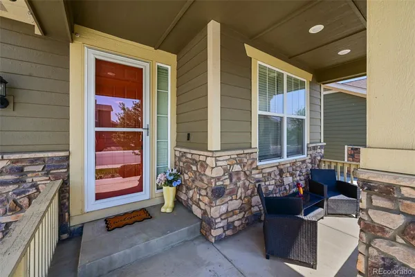 a outdoor living space with patio furniture and a fireplace