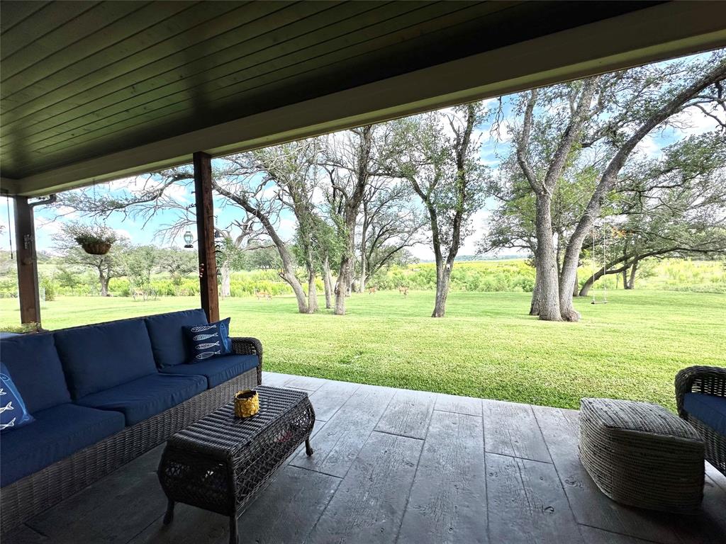 125 Drake Court Comanche, TX 76442 - Photo 15 of 35 a living room with furniture and a big yard