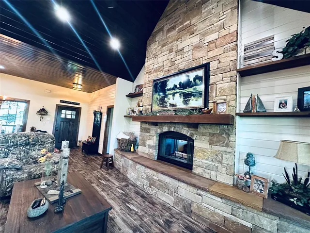 a front view of a house with a yard and trees