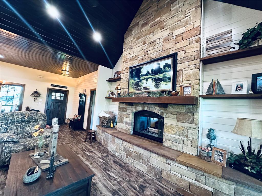 125 Drake Court Comanche, TX 76442 - Photo 21 of 35 a living room with furniture and a fireplace