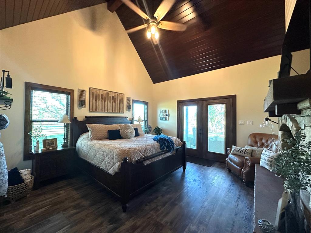 125 Drake Court Comanche, TX 76442 - Photo 24 of 35 a spacious bedroom with a large bed and a large window