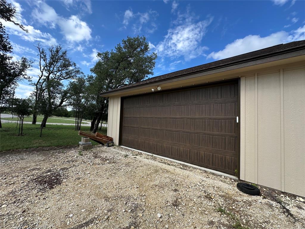 125 Drake Court Comanche, TX 76442 - Photo 28 of 35 a backyard of a house with lots of green space