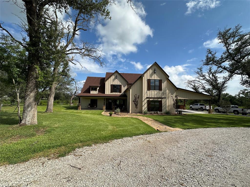 125 Drake Court Comanche, TX 76442 - Photo 29 of 35 a front view of a house with a yard and trees