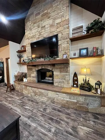 a living room with furniture and a painting on the wall