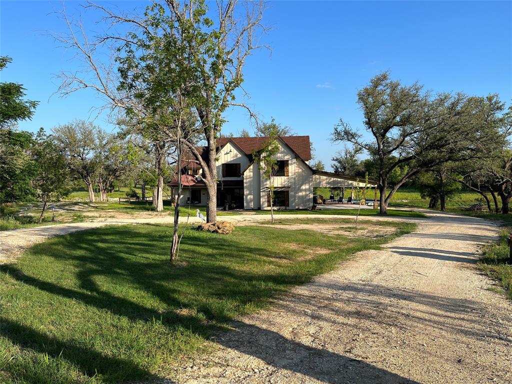 125 Drake Court Comanche, TX 76442 - Photo 9 of 35 a view of a fountain in front of a house