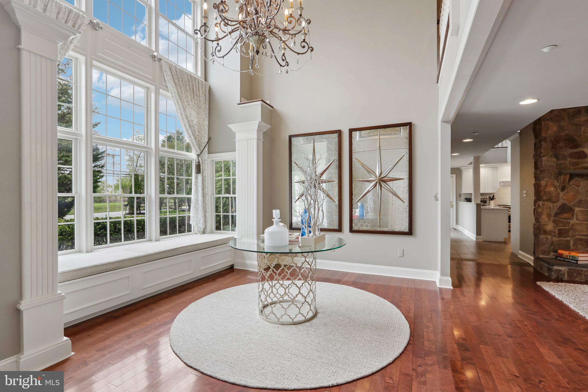 209 Welsh Road Ambler, PA 19002 - Photo 4 of 80 a view of a dining room with furniture wooden floor and a chandelier