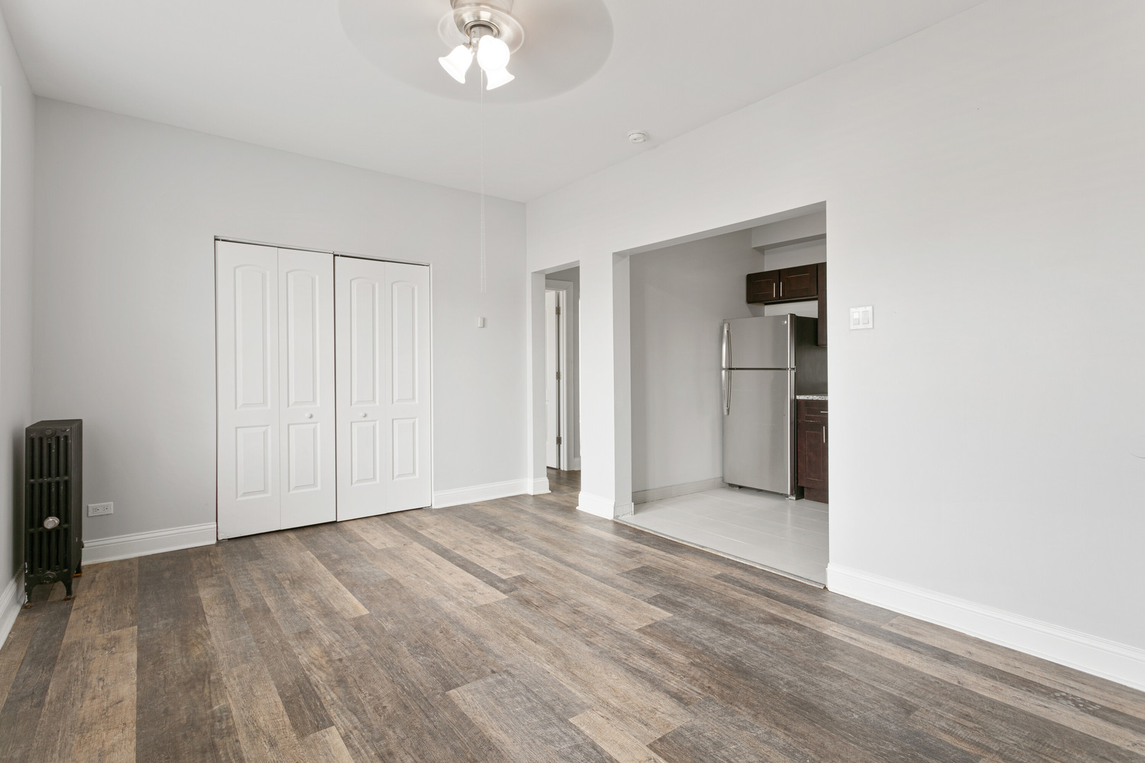 1608 West Sherwin Avenue, Unit 412 Chicago, IL 60626 - Photo 4 of 11 a view of empty room with wooden floor