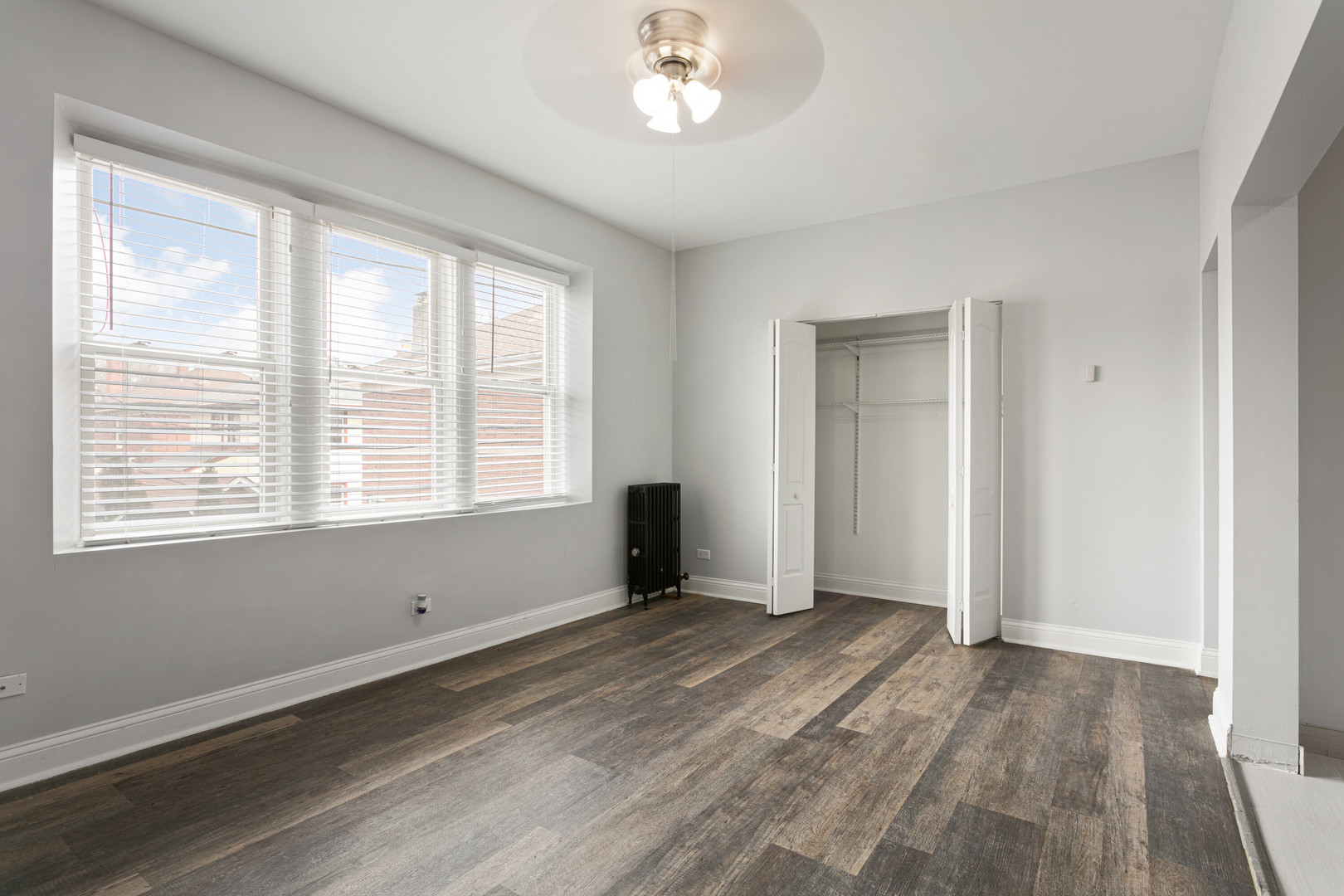 1608 West Sherwin Avenue, Unit 412 Chicago, IL 60626 - Photo 5 of 11 a view of an empty room with a window