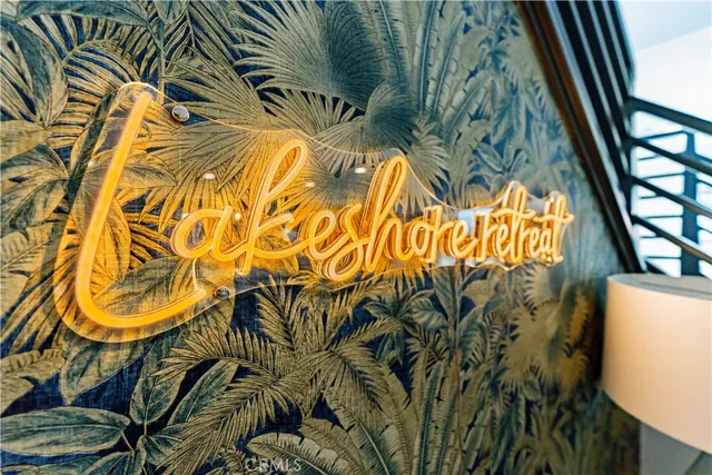 a large bed sitting in a bedroom next to a window