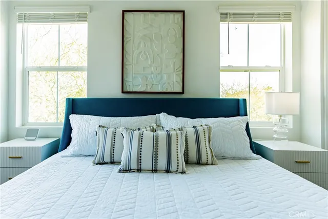 a bedroom with a bed and window