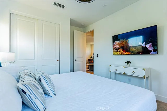 a bedroom with two beds and a table