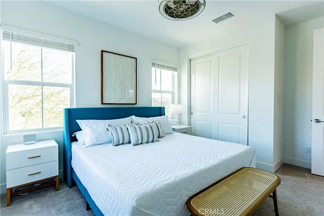 a bathroom with a double vanity sink toilet and shower