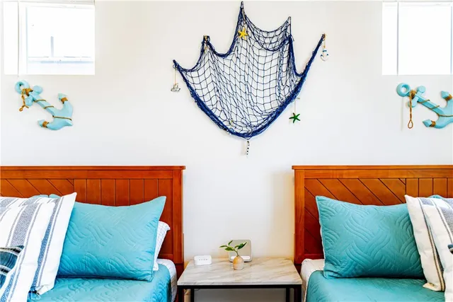 a living room with furniture a rug and a lamp