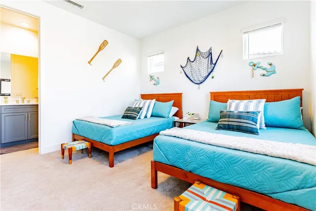 a living room with furniture a air conditioner vent and a window