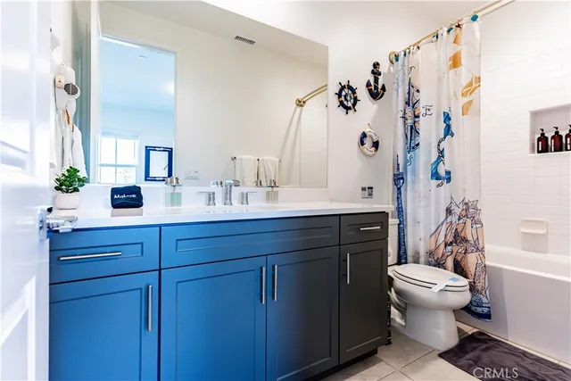 a bedroom with a bed and wall painting