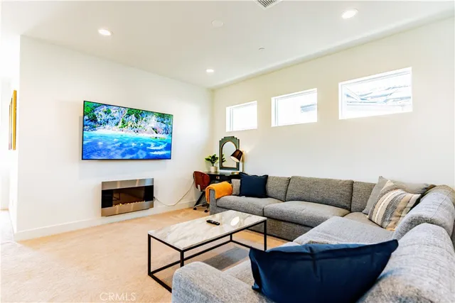 a vase of flowers sitting on a table in front of a window