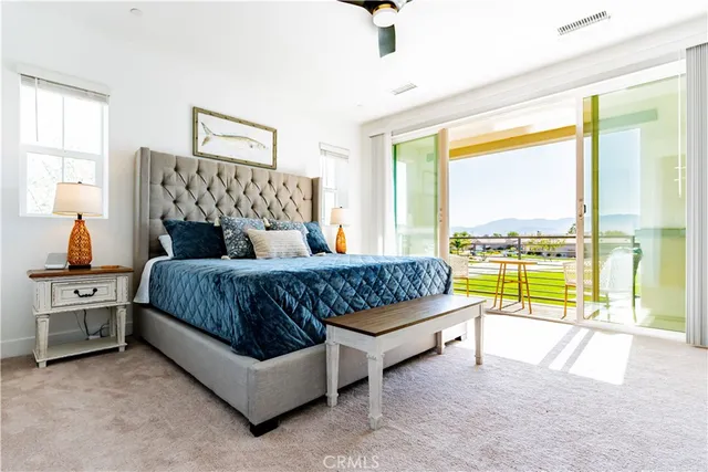 a large bathroom with a double vanity sink a mirror and next to a window