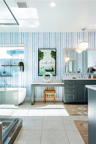 a view of a house with a yard and table and chairs in front of a house