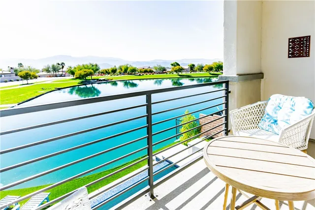 a view of a lake with outdoor seating and lake view