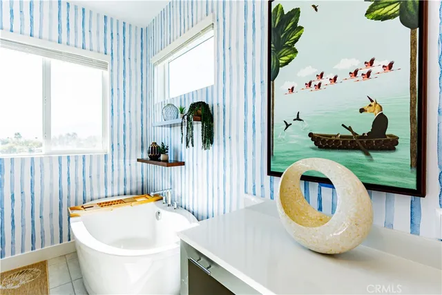 a front view of a house with garden and patio