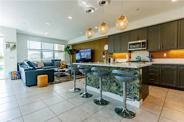 a kitchen with granite countertop a sink and a stove