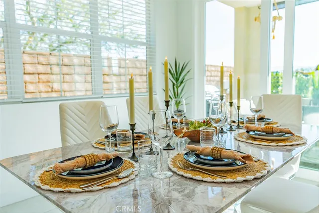 a kitchen with stainless steel appliances kitchen island granite countertop a sink and cabinets