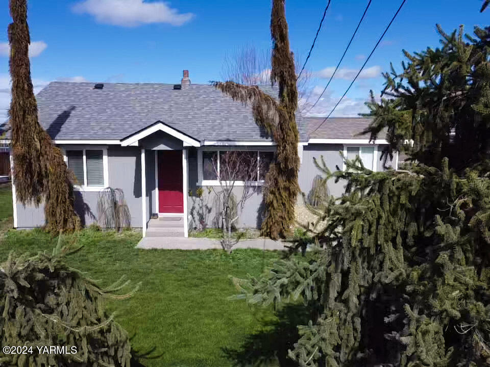 1451 Outlook Road Outlook, WA 98938 - Photo 2 of 27 a front view of a house with a yard table and chairs