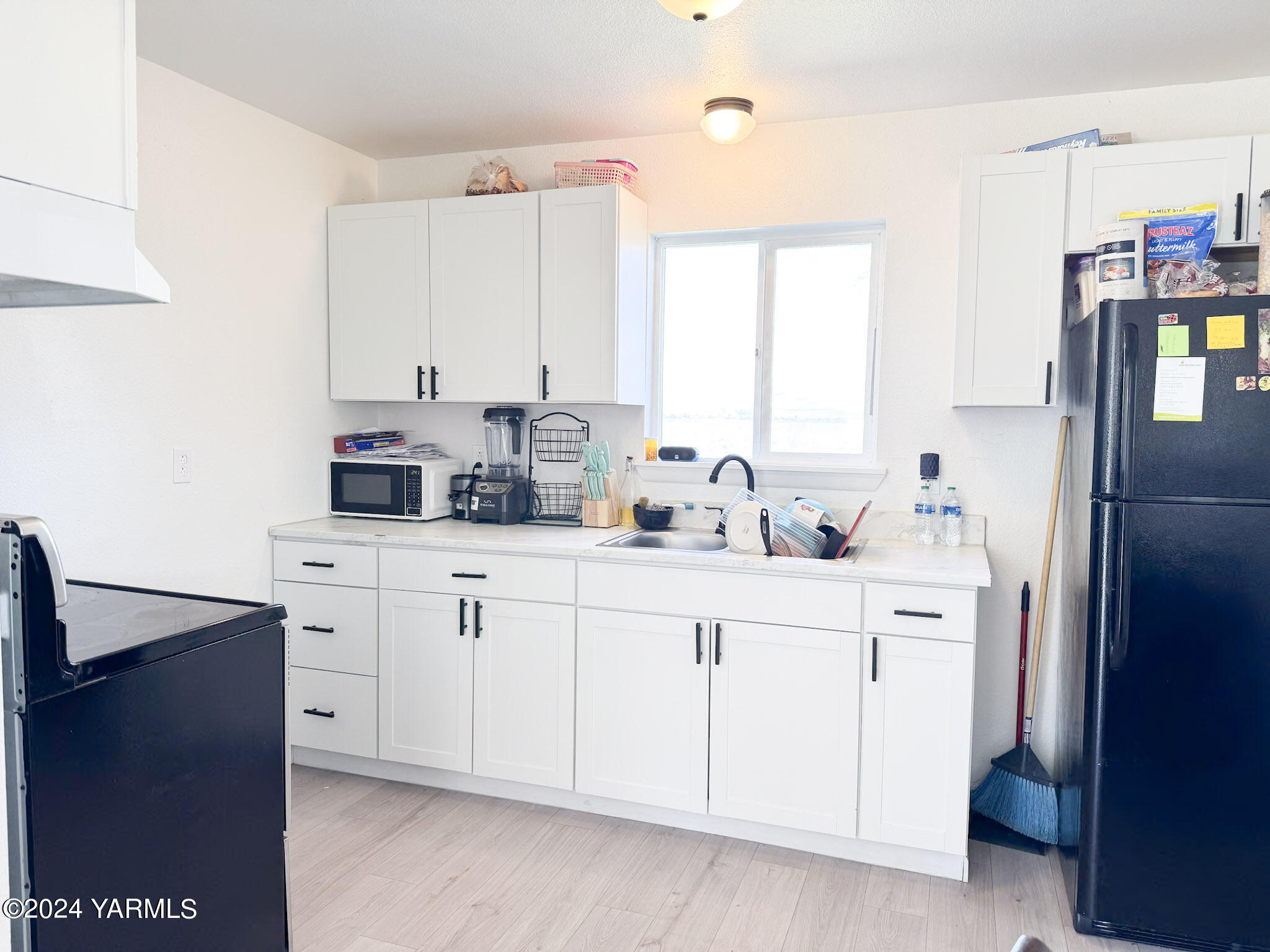 1451 Outlook Road Outlook, WA 98938 - Photo 5 of 27 a kitchen with cabinets appliances a sink and a counter top space