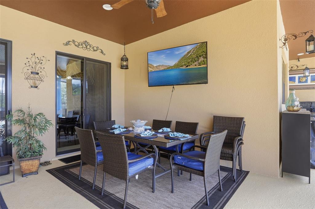 13429 Montevista Road Clermont, FL 34711 - Photo 55 of 89 a dining room with furniture and wooden floor